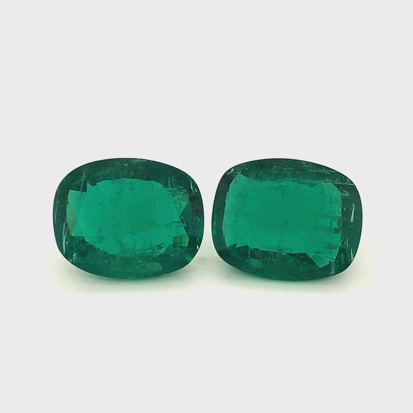 
                  
                    Load and play video in Gallery viewer, 25.02x20.05x9.60mm Cushion Emerald Pair (2 pc 62.44 ct)
                  
                