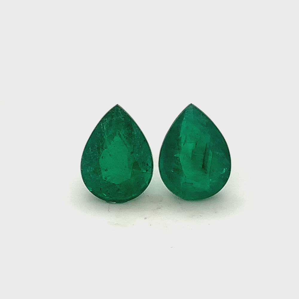
                  
                    Load and play video in Gallery viewer, 12.20x9.10x0.00mm Pear-shaped Emerald (2 pc 7.41 ct)
                  
                