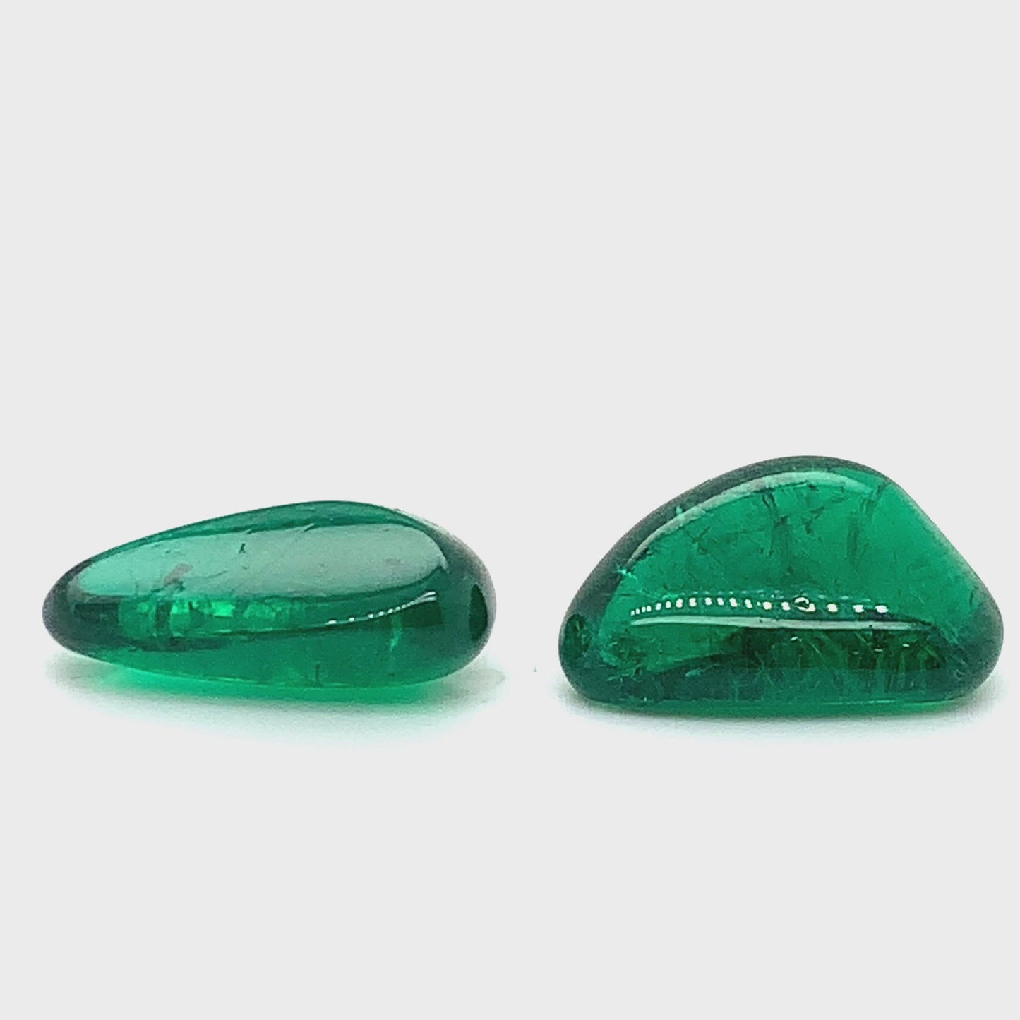 
                  
                    Load and play video in Gallery viewer, 22.35x13.94x8.11mm Tumble Emerald Pair (2 pc 37.35 ct)
                  
                