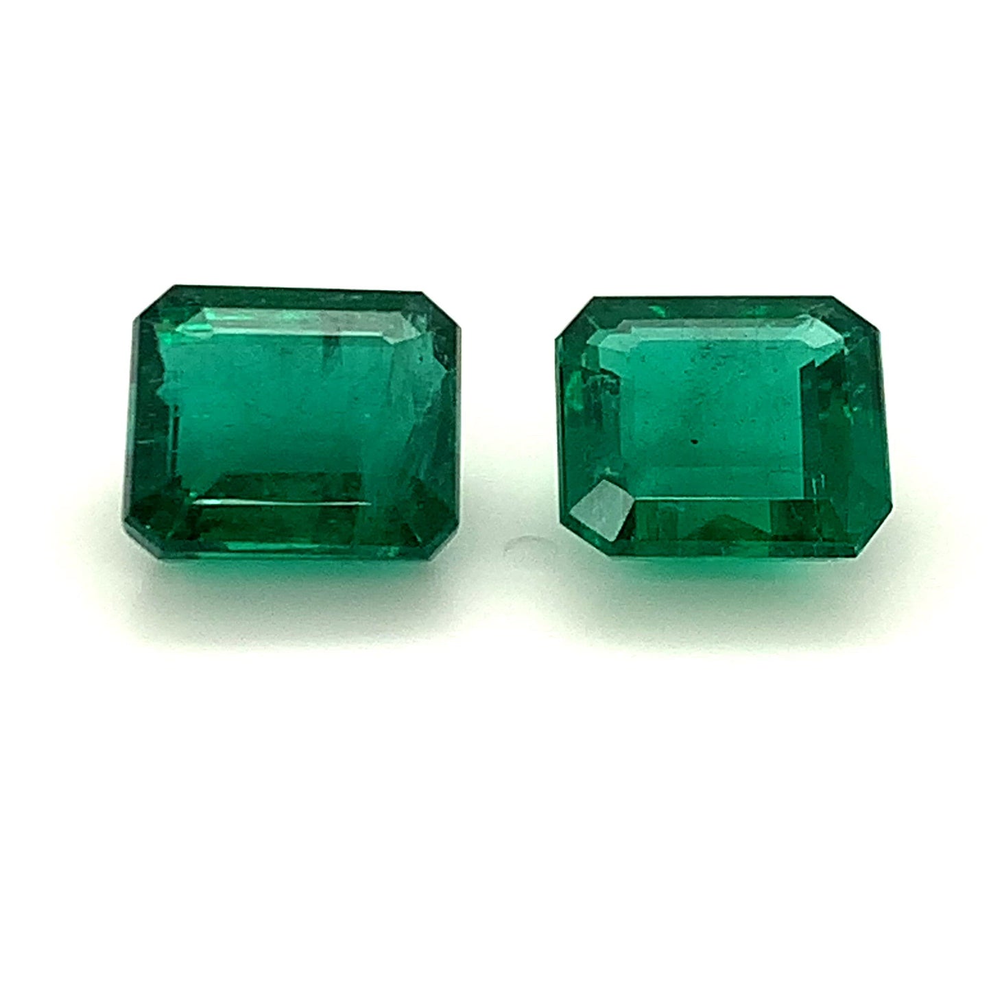 
                  
                    Load and play video in Gallery viewer, 11.70x10.43x6.13mm Octagon Emerald Pair (2 pc 13.22 ct)
                  
                