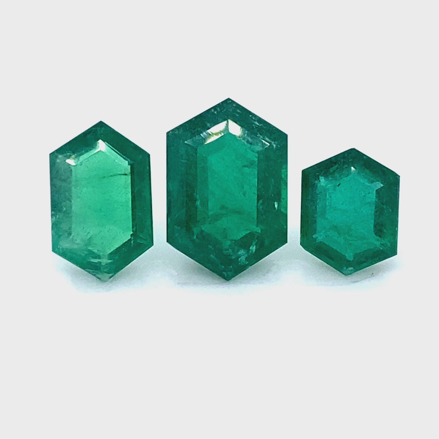 
                  
                    Load and play video in Gallery viewer, 13.00x8.00x4.10mm Hexagonal Emerald (2 pc 8.92 ct)
                  
                